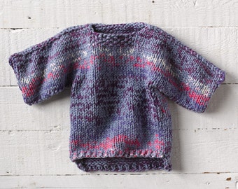 One of a kind, hand knit sweater in lovely shades of blue, purple, pink and cream. A unique statement piece for baby's wardrobe.