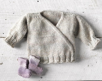 One of a kind. Hand Knit Wrap Sweater in soft Irish wool size 0-6 months. Comes with soft hand knit lavender socks.