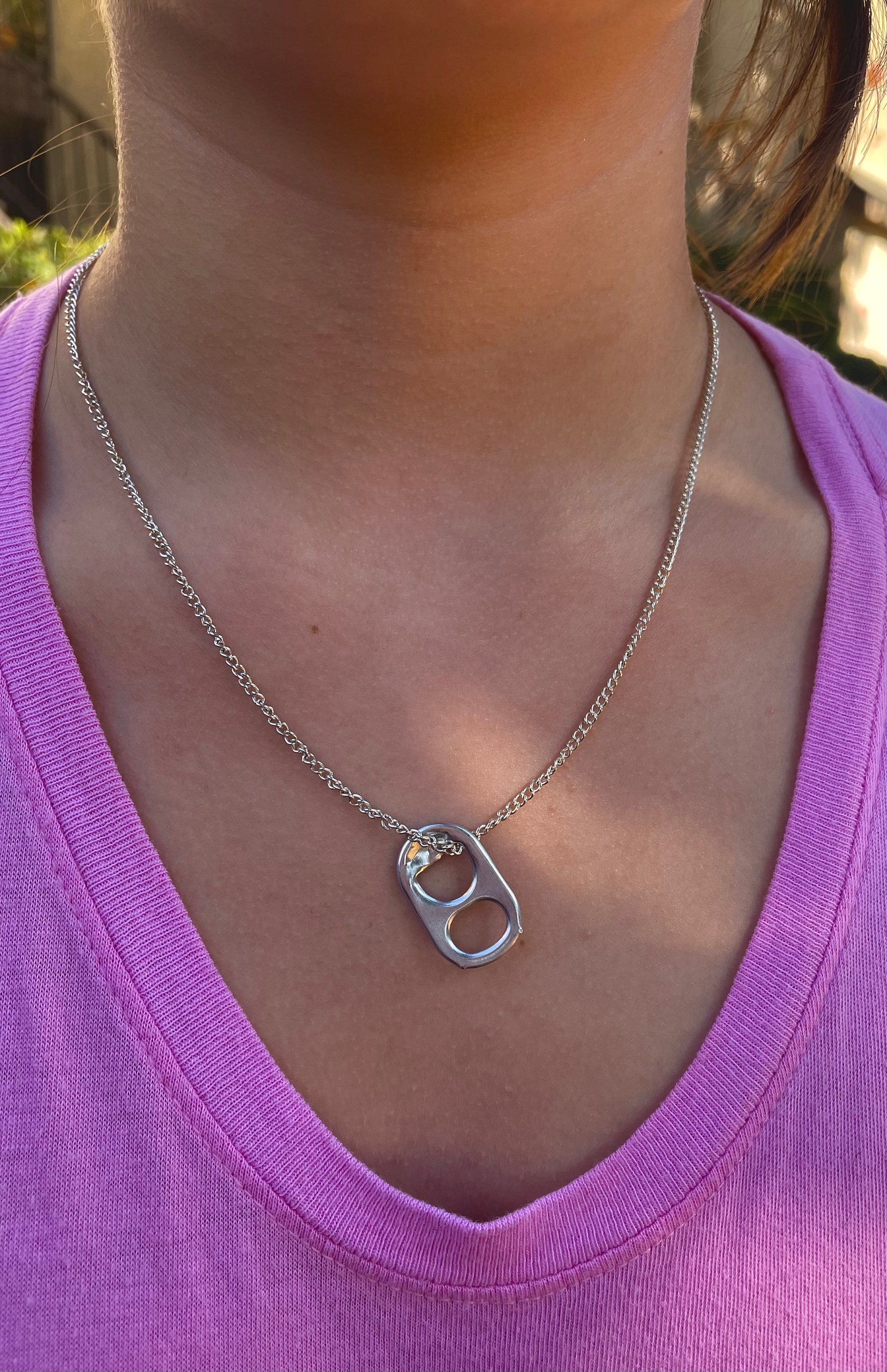 Why Does Sarah Wear A Can Tab Necklace