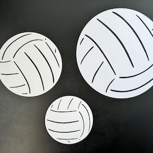 Volleyball cutout decorations in white with black seams