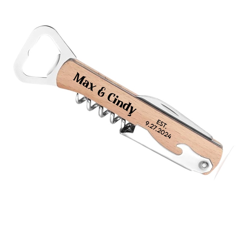 May include: A wooden and stainless steel multi-tool bottle opener with a corkscrew, knife, and bottle opener. The tool is engraved with "Max & Cindy EST. 9.27.2024".