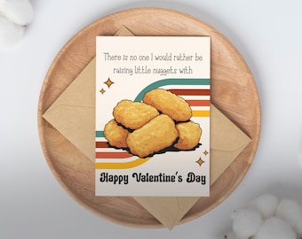 May include: A Valentine's Day card with a retro design, showing a pile of chicken nuggets. The card says "There is no one I would rather be raising little nuggets with" and "Happy Valentine's Day."
