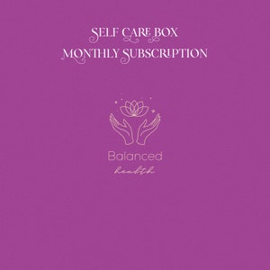 May include: A purple background with a white outline of a lotus flower with two hands cupping it. The text "SELF CARE BOX MONTHLY SUBSCRIPTION" is at the top of the image. The text "Balanced health" is below the hands and flower.