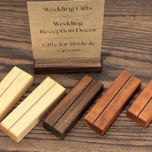 May include: A set of three ceramic mugs with a speckled, matte finish. The mugs are in shades of cream, light gray, and dark gray. Each mug has a simple, minimalist design, perfect for coffee or tea.