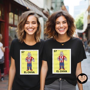 May include: Two women wearing black t-shirts with a graphic of a goat wearing a soccer jersey. The graphic is in a yellow and white frame with the text "57 MY LATIN HEART EL CHIVA".