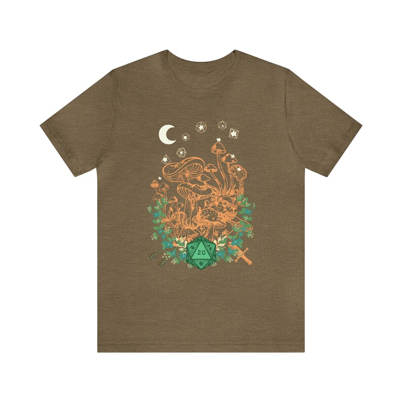 May include: A brown t-shirt with a green 20-sided die, orange mushrooms, and a crescent moon with stars in the background.