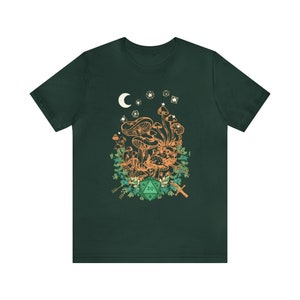 May include: A dark green t-shirt with a graphic of a cluster of mushrooms, a crescent moon, stars, and a green twenty-sided die.