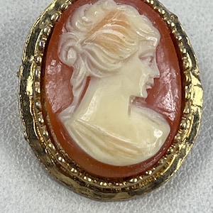 Gold tone cameo brooch