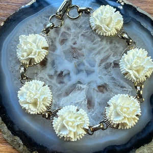 Vintage gold tone white floral bracelet