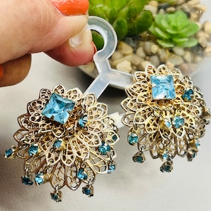 Vintage gold tone blue glass rhinestone tiered clip earrings