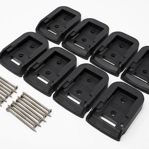 May include: Eight black plastic battery holders with eight silver screws. The holders are designed to mount batteries to a surface.