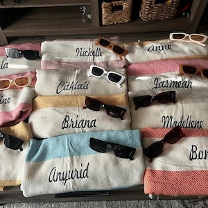 Personalized Turkish beach towel, custom beach towel, personalized gifts, custom wedding gifts, bridesmaid gifts, bachelorette party favors, gifts for her, personalized wedding gifts, custom bridesmaid towels, embroidered beach towels, unique gifts for her, Turkish towels, custom gifts for women, beach towels with initials, bridal party gift ideas, personalized towels for bride, beach towel gift for bridesmaid, custom name beach towel, thoughtful wedding gift.