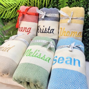 Personalized Turkish beach towel, custom beach towel, personalized gifts, custom wedding gifts, bridesmaid gifts, bachelorette party favors, gifts for her, personalized wedding gifts, custom bridesmaid towels, embroidered beach towels, unique gifts for her, Turkish towels, custom gifts for women, beach towels with initials, bridal party gift ideas, personalized towels for bride, beach towel gift for bridesmaid, custom name beach towel, thoughtful wedding gift.