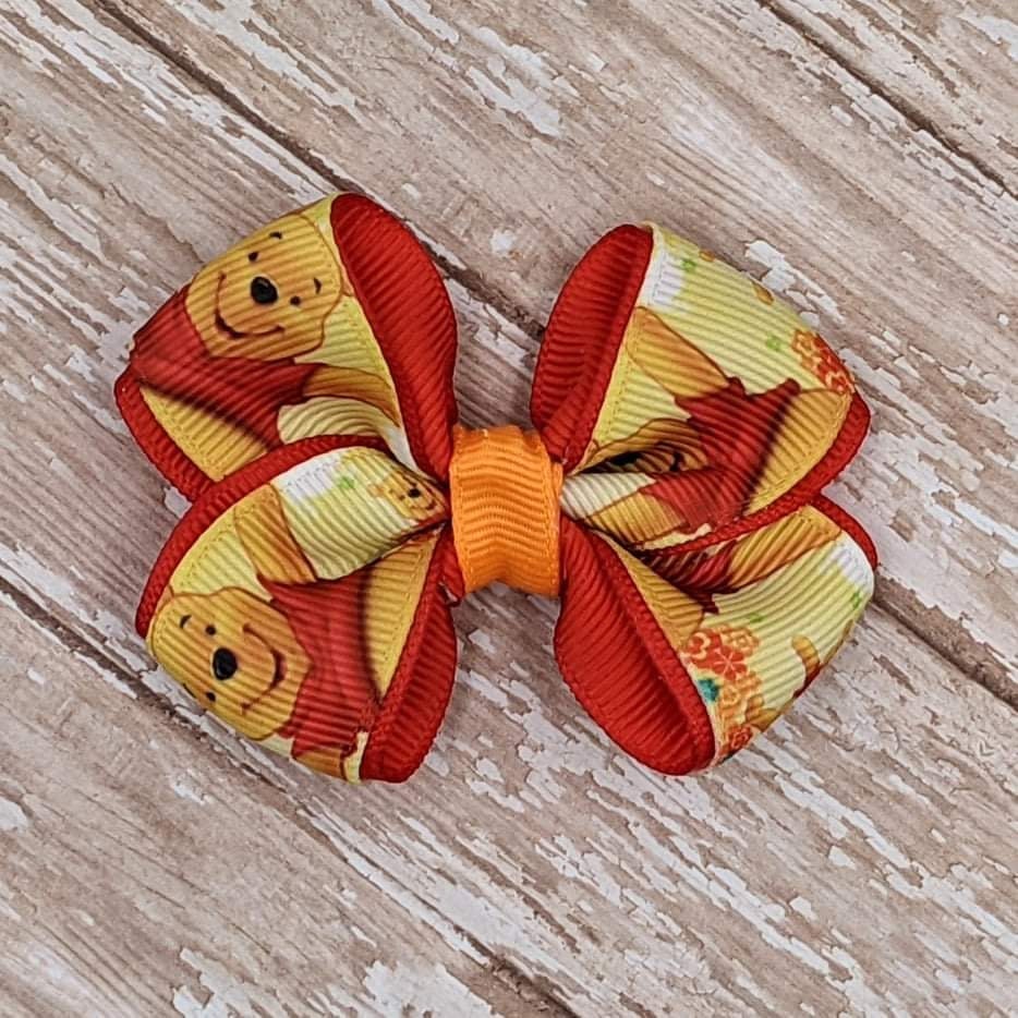 Ribbon Chick - #theribbonchicks 4” Winnie the Pooh Faux Leather Bow 6  available. #fauxleatherbows #hairbows #bows #winniethepooh  #winniethepoohbow #poohhairbow