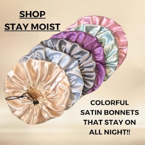 May include: A set of colorful satin bonnets in various shades of pink, purple, blue, and beige. The bonnets are made of soft, silky satin and are designed to help keep hair moisturized and protected while sleeping. The text "SHOP STAY MOIST" is displayed at the top of the image. The text "COLORFUL SATIN BONNETS THAT STAY ON ALL NIGHT!!" is displayed at the bottom of the image.