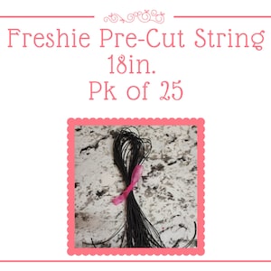 May include: A pack of 25 black pre-cut strings, each 18 inches long. The strings are bundled together and tied with a pink ribbon. Freshie Pre-Cut String 18in. Pk of 25.