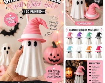 May include: A white 3D printed ghost-shaped can cooler featuring a removable pink witch hat. The ghost has two black oval eyes and a hollow centre designed to hold a beverage can. A straw can be inserted through the top of the hat. The text GHOST CAN COOLER with Witch Hat is visible at the top of the image.