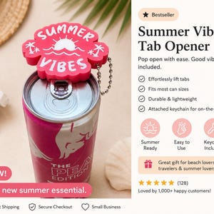 May include: A red "Summer Vibes" tab opener attached to a can of soda. The opener is shaped like a flower and has a keychain. The can is pink and white with text. Sunglasses and a straw hat are in the background.