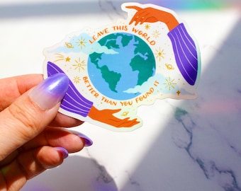 May include: A sticker featuring a colourful illustration of the Earth surrounded by stars and planets. The text reads "Leave this world better than you found it."