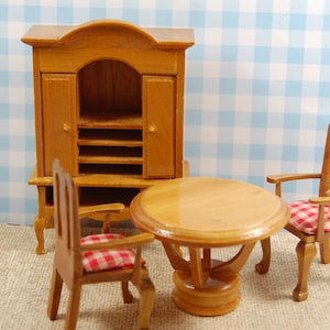 Vintage Dollhouse Hutch, table with two red plaid cushion chairs.