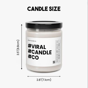 a white candle with a black lid and a black lid