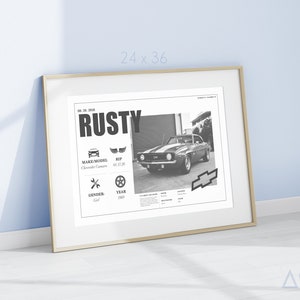 May include: Black and white photo of a classic Chevrolet Camaro with the name "Rusty" printed above it. The photo is framed in a gold frame and has a white mat. The photo includes details about the car, such as the make, model, year, and gender.
