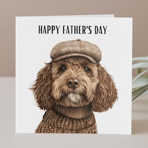 May include: A Father's Day card featuring a detailed illustration of a brown dog wearing a tweed cap and a brown sweater. The text "HAPPY FATHER'S DAY" is printed above the dog on a white background.