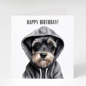 May include: A black and white dog wearing a gray hoodie with the text "HAPPY BIRTHDAY!" on a white background.
