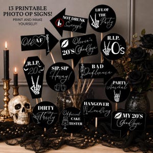 May include: Thirteen black and white printable photo op signs on wooden sticks featuring skeleton hand graphics and text including Old AF, Life of the Party, R.I.P. 20s, Sip Sip Hooray, Bad Influence, Party Animal, Dirty Thirty, Official Cake Tester, and Hangover Loading.