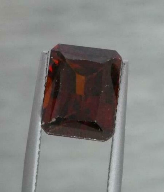 Natural 6.52ct loose red emerald cut zircon gem,10