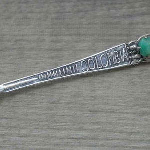 Beautiful vintage silver columbian souvenir fork with natural rough emerald