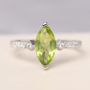 Delicate peridot vertical engagement ring silver marquise cut August birthstone ring