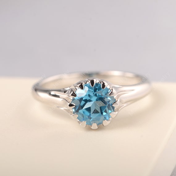 Sterling Silver London and Swiss Blue Topaz Star Curved Ring Sterling Silver London and Swiss Blue Topaz Star Curved Ring