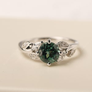 Green sapphire engagement ring with leaves round shaped silver floral ring