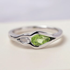 Peridot engagement ring silvrer pear shaped green stone August birthstone mothers ring