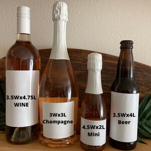 May include: Four bottles of alcoholic beverages: wine, champagne, mini, and beer. The wine bottle is 3.5 inches wide and 4.75 liters. The champagne bottle is 3 inches wide and 3 liters. The mini bottle is 4.5 inches wide and 2 liters. The beer bottle is 3.5 inches wide and 4 liters.