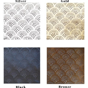 May include: Four samples of decorative metal sheet with a repeating pattern of overlapping circles and dots. The samples are in silver, gold, black, and bronze.