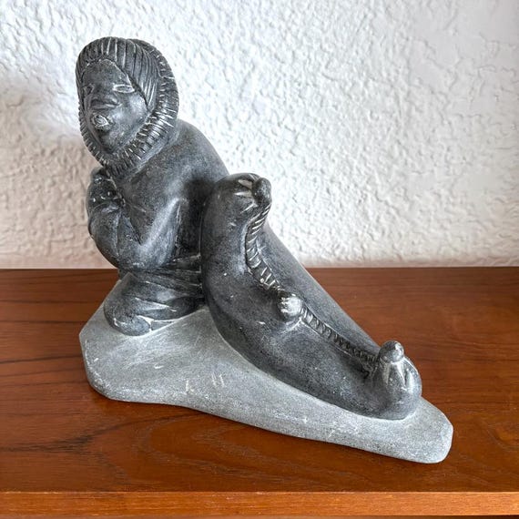 Signed Tivi Etok Inuit Soapstone Carving: Hunter With Seal