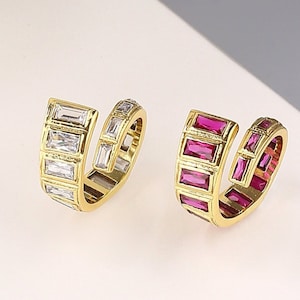 Spiral baguette ring gold. Statement Zirconia ring shiny. Snake cross shank ring. Art Deco rings. Pink Sapphire ring. Designer ring brass.