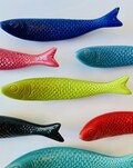 Handmade ceramic hanging sardine product logo