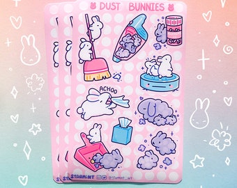 May include: A sheet of pink stickers featuring cute cartoon bunnies with the text "Dust Bunnies". The stickers depict bunnies cleaning, sneezing, and creating dust bunnies.