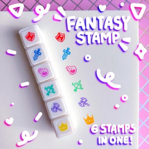 May include: A white Fantasy Stamp set featuring six fantasy-themed designs. The stamps include a shield, sword, potion, bow and arrow, axe, and crown. The text "FANTASY STAMP" and "6 STAMPS IN ONE!" are also visible.