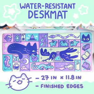 May include: A water-resistant desk mat with a whimsical design featuring a black cat, a crow with a potion, a snake, frogs, and other magical elements. The mat is 27 inches by 11.8 inches and has finished edges.