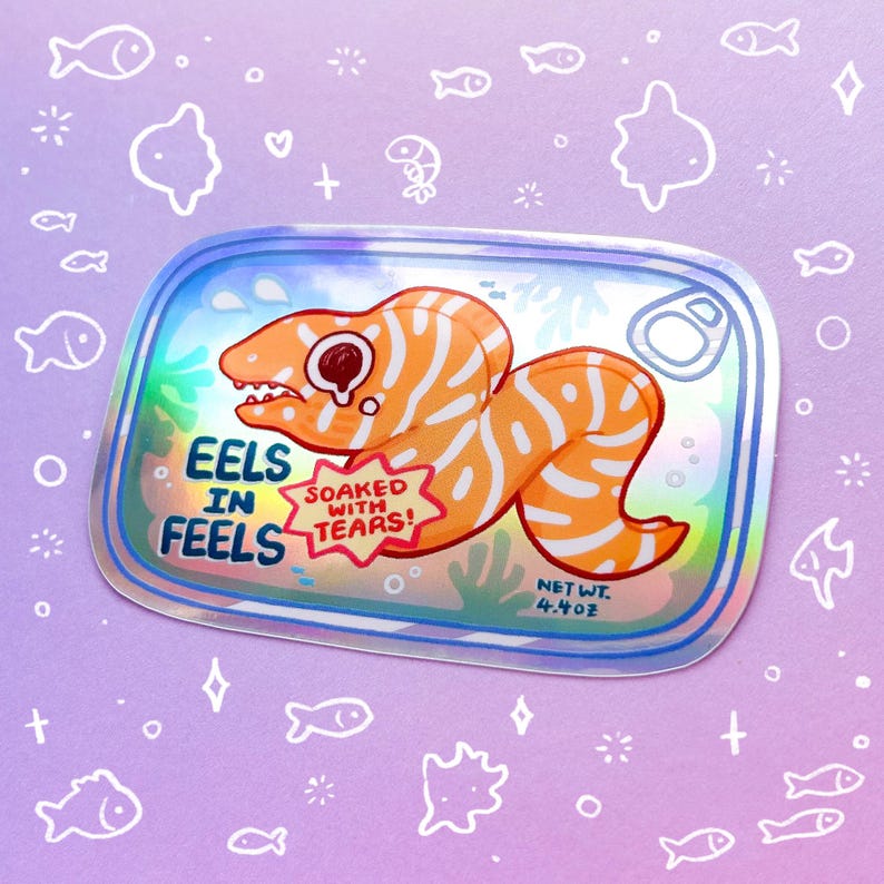May include: A holographic sticker of a cartoon eel in a can with the text "Eels in Feels" and "Soaked with Tears!"  The can has a pull tab and the text "Net Wt. 4.4 oz".