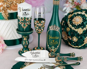 May include: Green and gold quinceanera party decorations including a cake knife, a bottle, a candle, a glass, and a plate. The decorations are decorated with rhinestones and the text "Vanessa Mis Quince Anos".