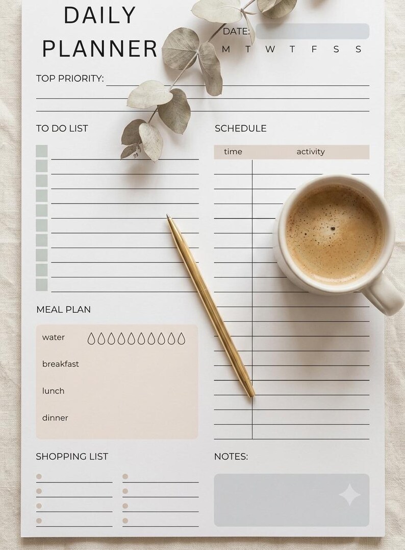 May include: A daily planner sheet with sections for top priority, to do list, schedule, meal plan with water intake icons, shopping list, and notes. The planner features black text on a white background with beige and gray accents, a gold pen, and a coffee mug.