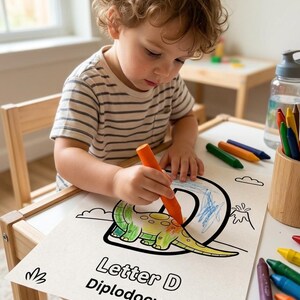 May include: A white coloring sheet featuring a large letter D, a cartoon Diplodocus dinosaur, and the text Letter D Diplodocus. The page is being colored with an orange crayon, with additional crayons and a water bottle nearby on the table.