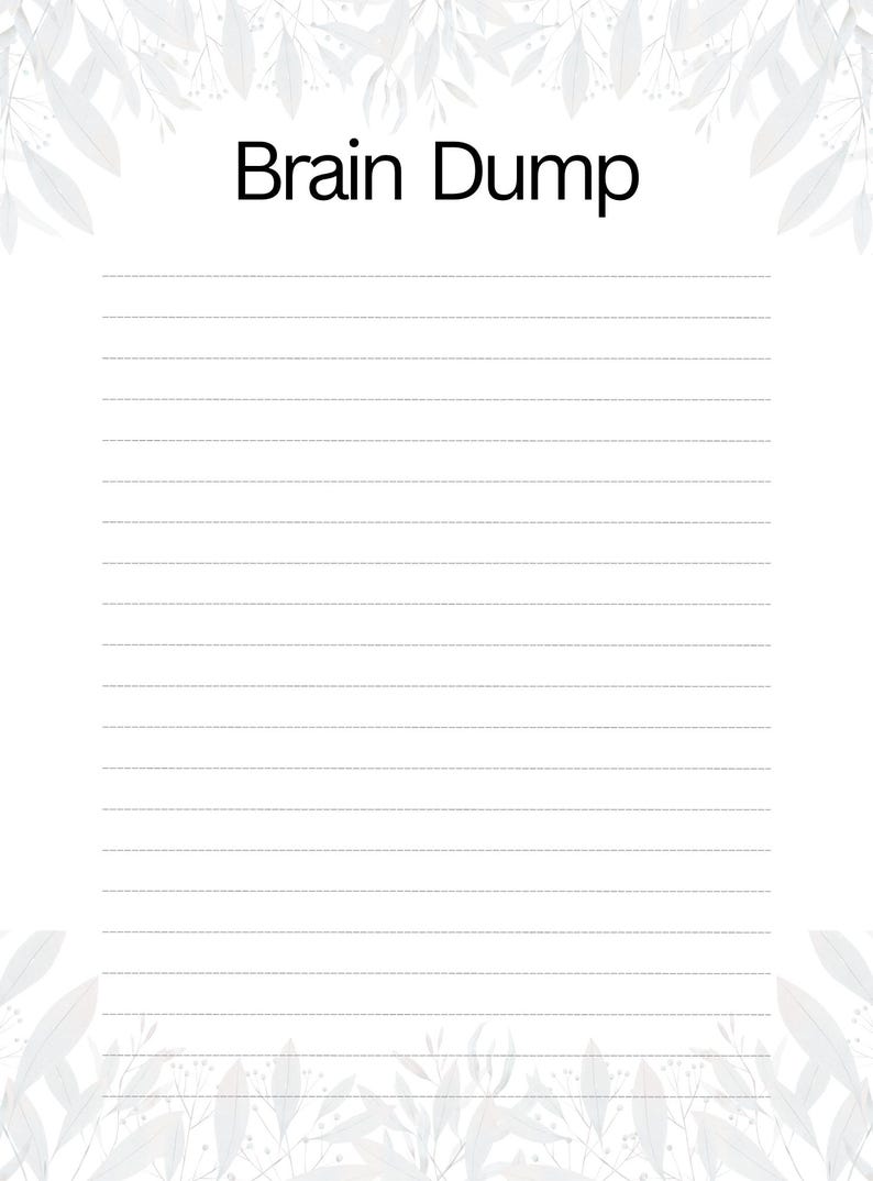 May include: A white paper sheet with the text Brain Dump printed in black at the top center. The page features horizontal lines for writing and is decorated with a light gray botanical leaf pattern along the top and bottom edges of the page.