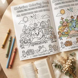 May include: An open Christian coloring book titled Christian Bible Adventure for Kids Ages 2-6, featuring line art of a globe, animals, and figures. Beside it are four crayons, a small open book with a cross bookmark, and a dried floral arrangement.