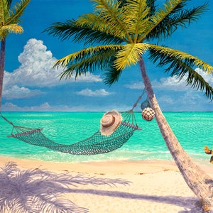 May include: A hammock hangs between two palm trees on a white sandy beach. The turquoise ocean water is in the background. A straw hat rests on the hammock.